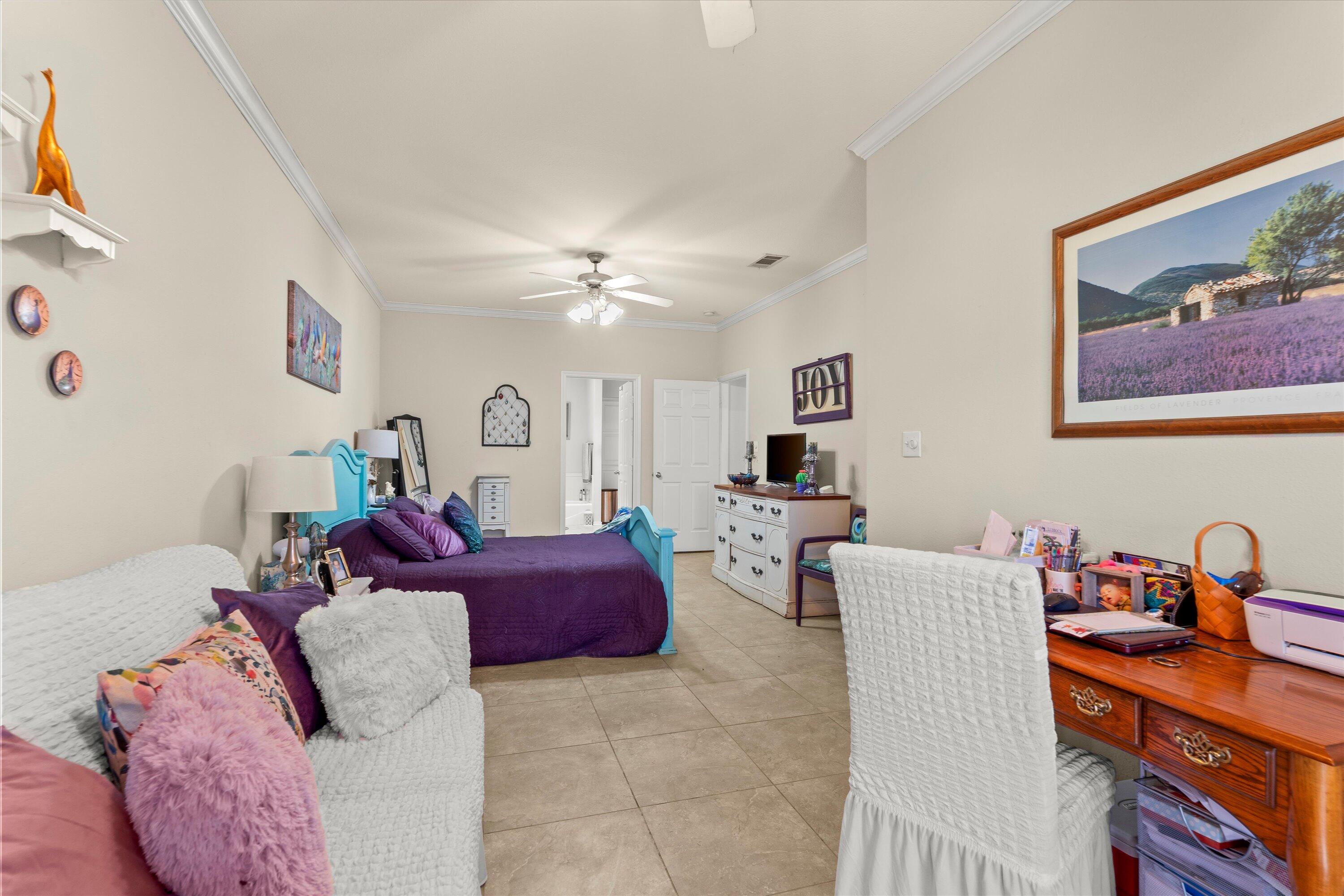 710 Poplar Street Levelland, TX 79336 - Photo 10 of 23 a living room with furniture and a chandelier