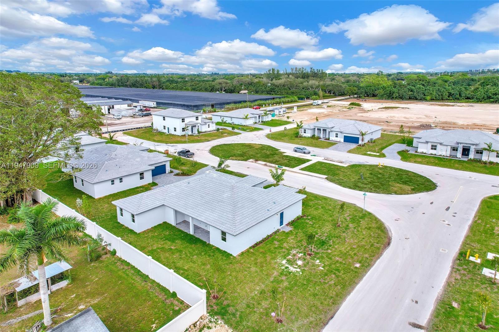27254 Southwest 159th Path Homestead, FL 33031 - Photo 18 of 100 an aerial view of a house with a swimming pool a yard and outdoor seating