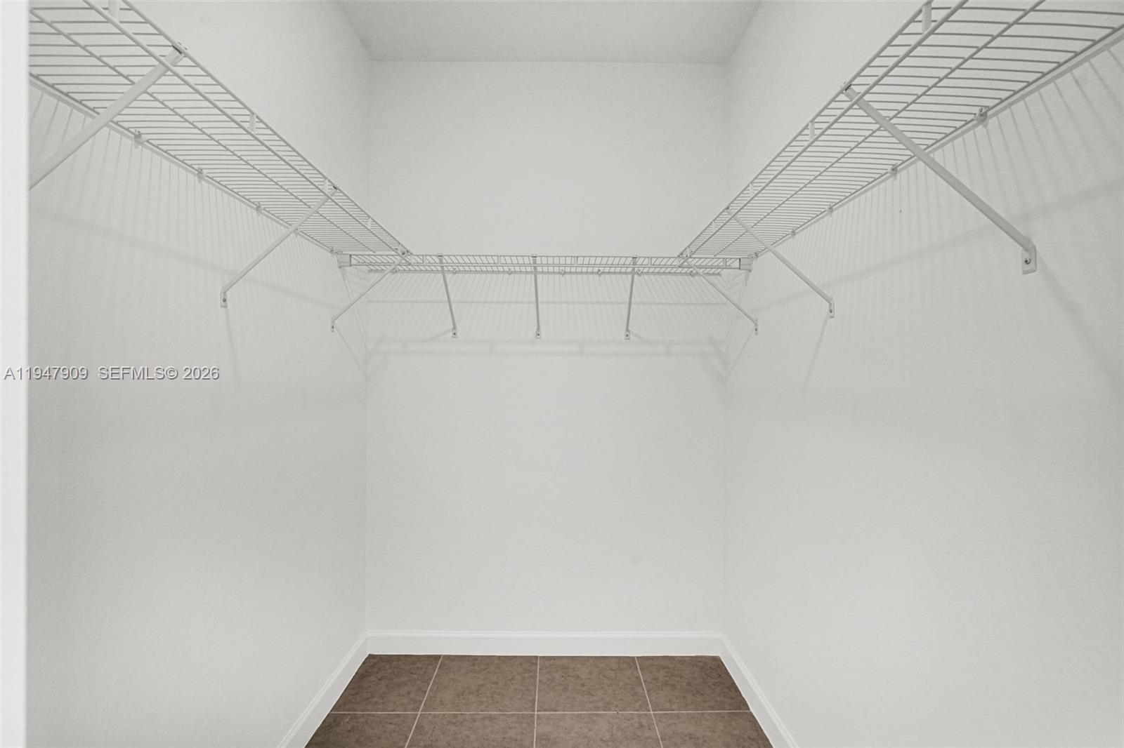 27254 Southwest 159th Path Homestead, FL 33031 - Photo 81 of 100 a view of a room with racks on the wall