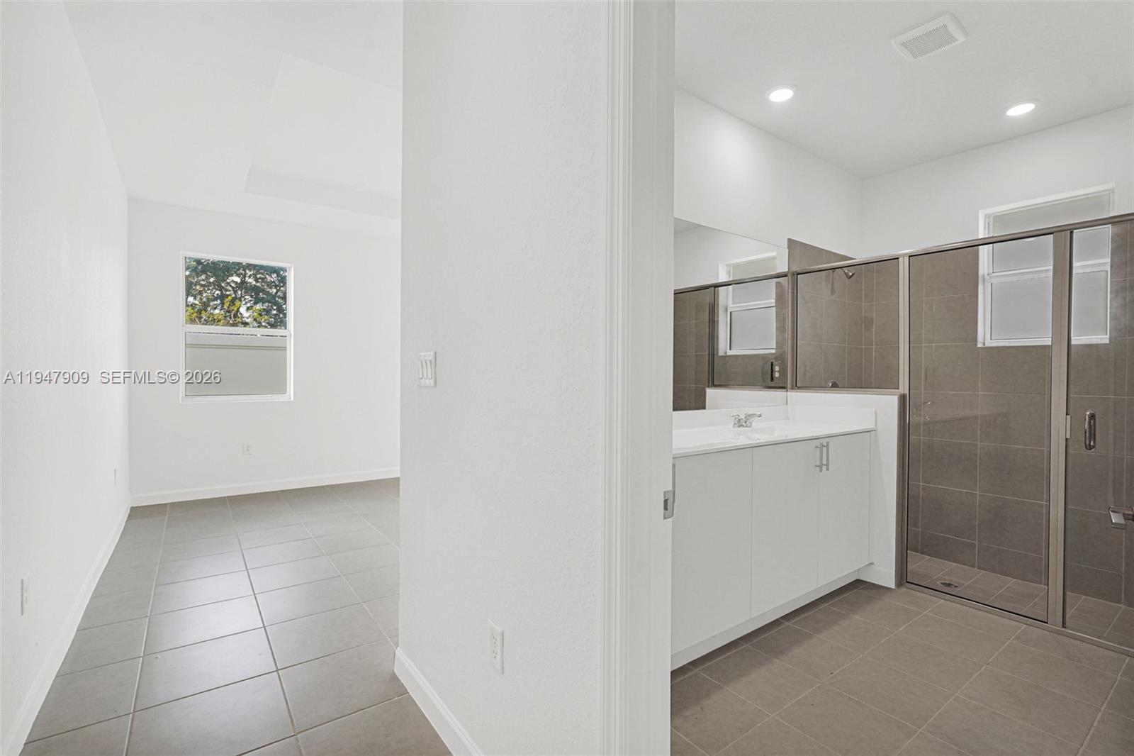 27254 Southwest 159th Path Homestead, FL 33031 - Photo 92 of 100 a bathroom with a sink a mirror and a shower
