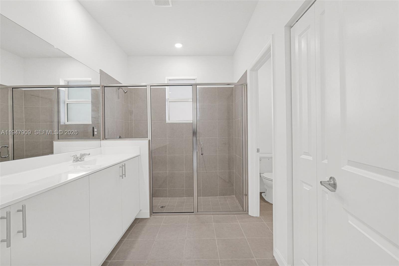 27254 Southwest 159th Path Homestead, FL 33031 - Photo 99 of 100 a bathroom with a double vanity sink and mirror