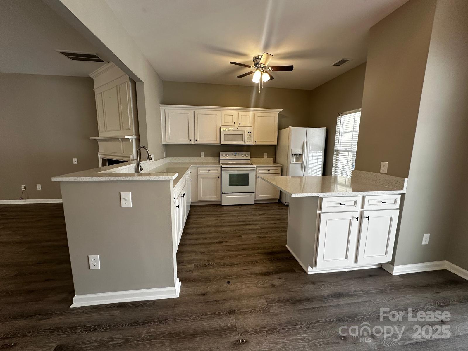 6828 Rothchild Drive Charlotte, NC 28270 - Photo 11 of 29 a kitchen with cabinets and wooden floor