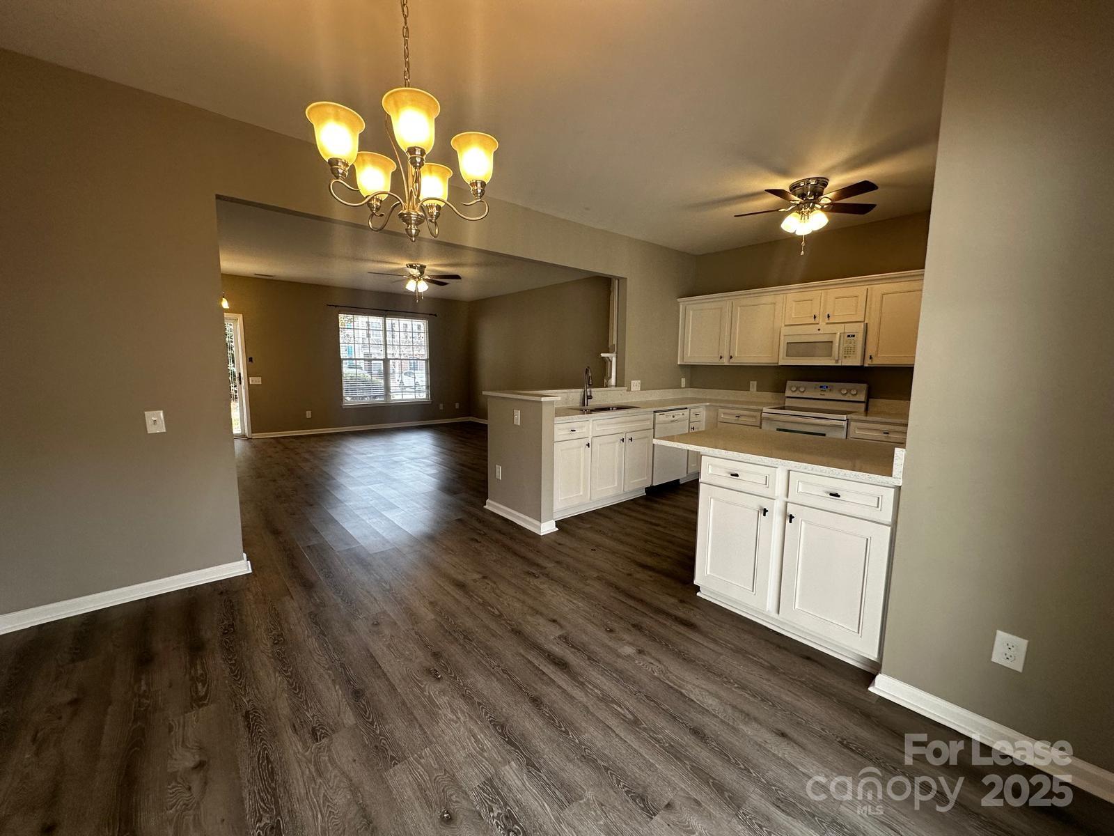 6828 Rothchild Drive Charlotte, NC 28270 - Photo 12 of 29 a kitchen with cabinets a sink and appliances