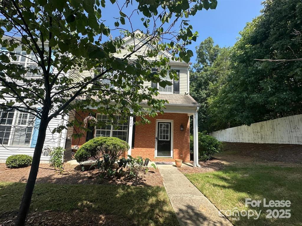 6828 Rothchild Drive Charlotte, NC 28270 - Photo 2 of 29 a view of a house with a tree in front of it