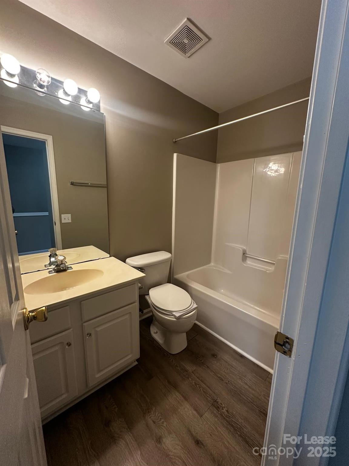 6828 Rothchild Drive Charlotte, NC 28270 - Photo 23 of 29 a bathroom with a double vanity sink toilet mirror and bathtub