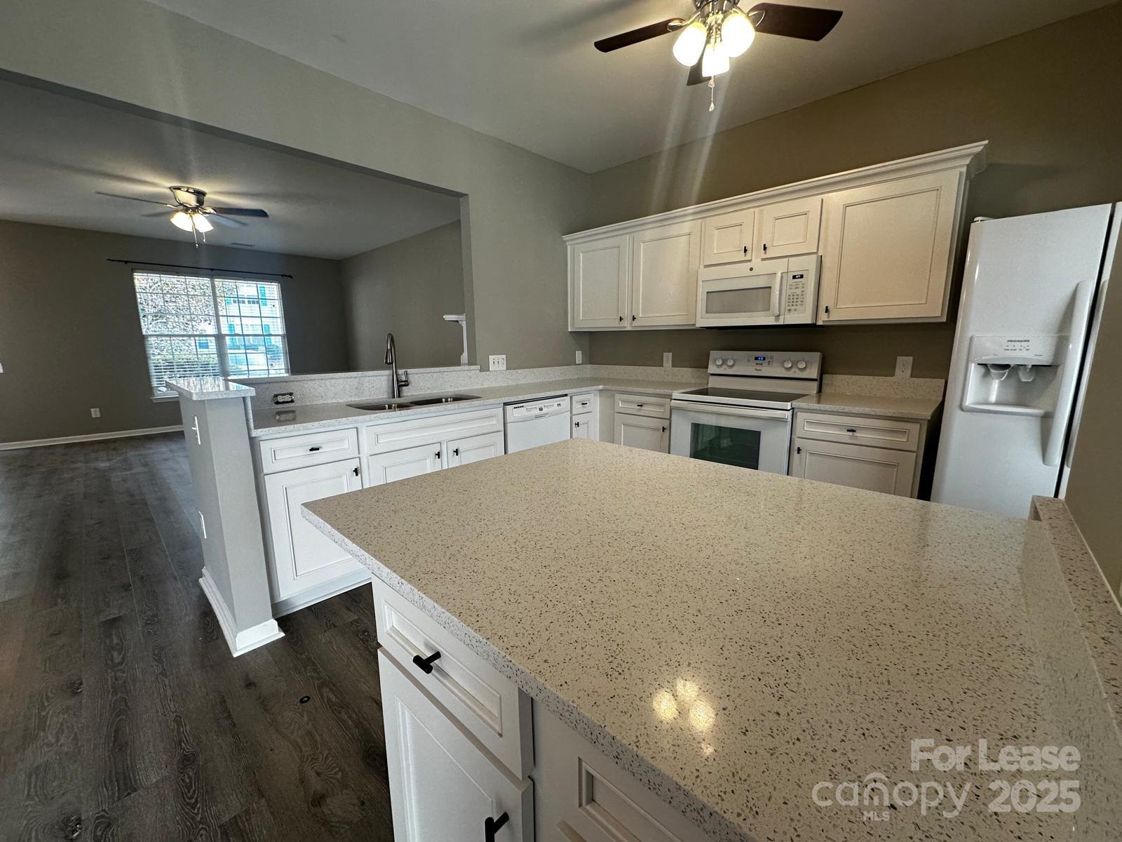 6828 Rothchild Drive Charlotte, NC 28270 - Photo 9 of 29 a kitchen with cabinets a sink and appliances
