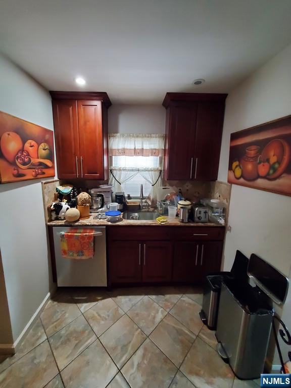 439 North 8th Street Fairview, NJ 07022 - Photo 11 of 20 a kitchen with stainless steel appliances granite countertop a stove a sink and a microwave
