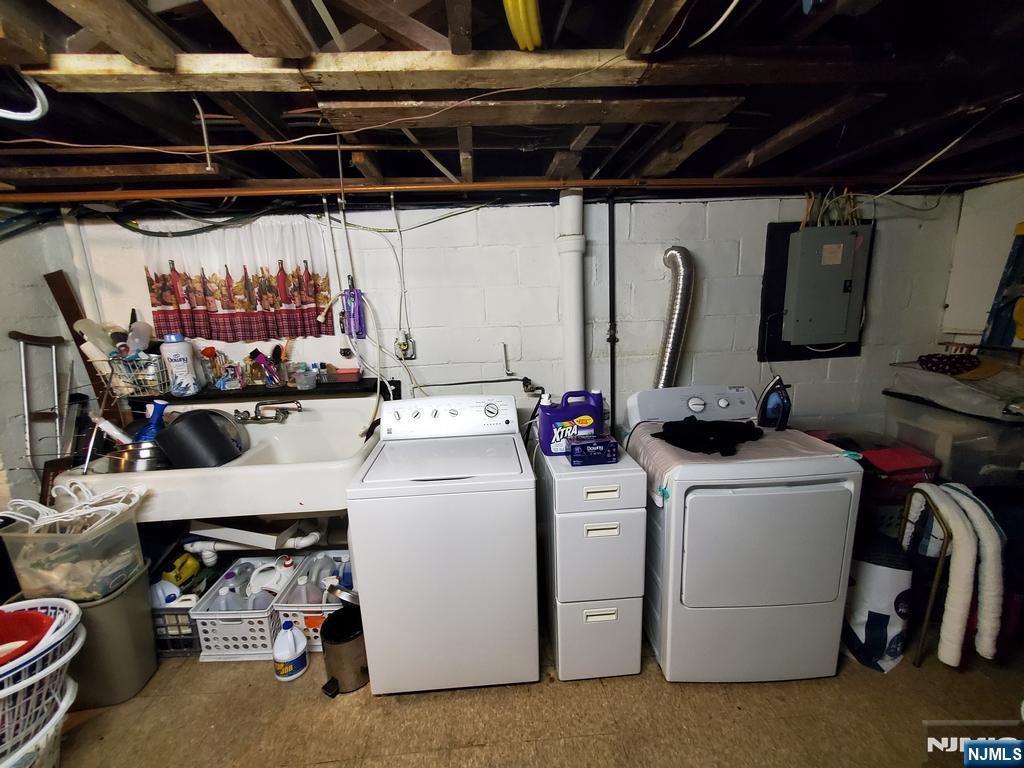 439 North 8th Street Fairview, NJ 07022 - Photo 14 of 20 a view of storage and utility room with washer and dryer