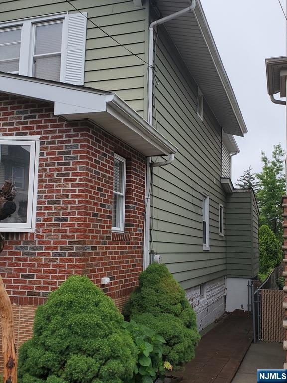 439 North 8th Street Fairview, NJ 07022 - Photo 18 of 20 a view of a house with a yard and sitting area