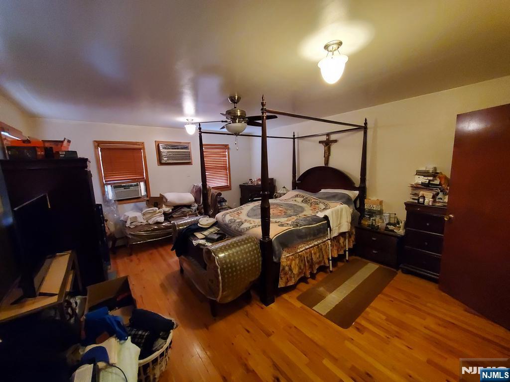 439 North 8th Street Fairview, NJ 07022 - Photo 3 of 20 a bedroom with bed and window