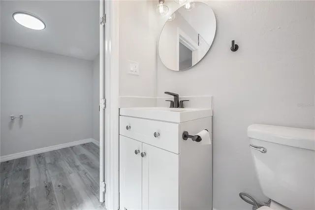a utility room with cabinets washer and dryer