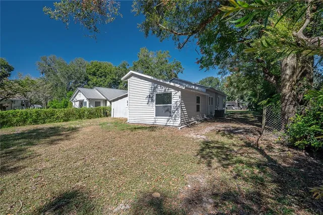 a view of a house with a yard and garage