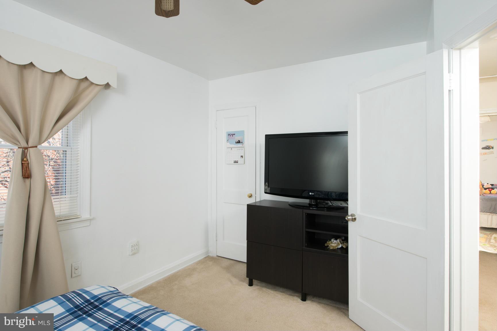 8331 Kavanagh Road Baltimore, MD 21222 - Photo 13 of 28 a room with furniture and flat screen tv