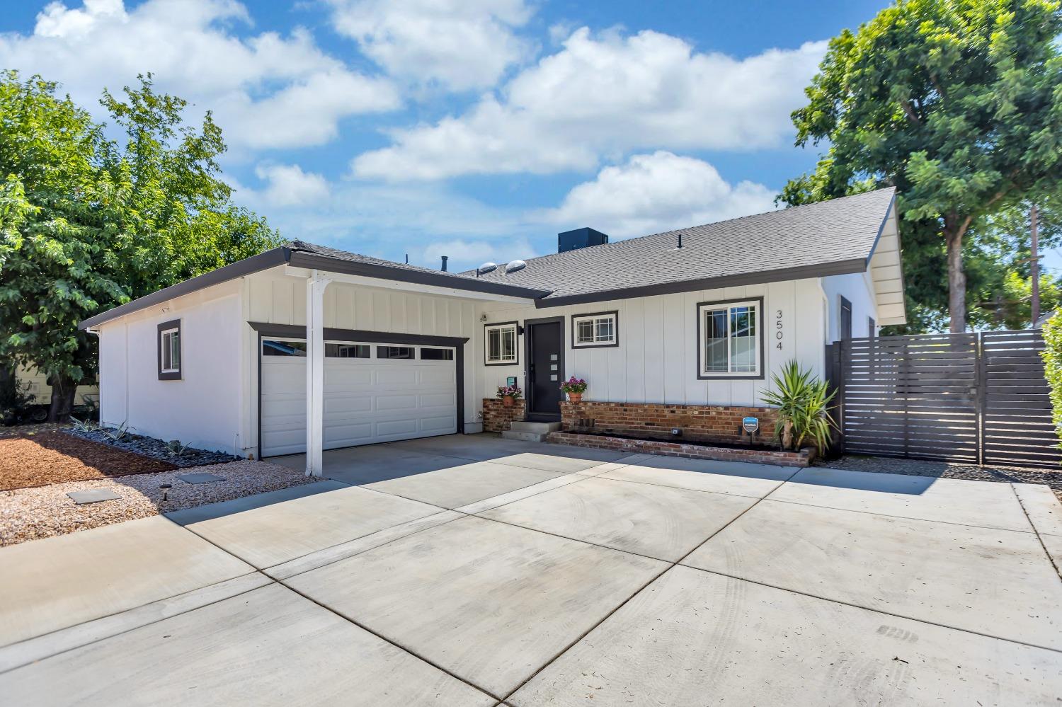 3504 Winston Way Carmichael, CA 95608 - Photo 1 of 1 a view of a house with a backyard and a garage
