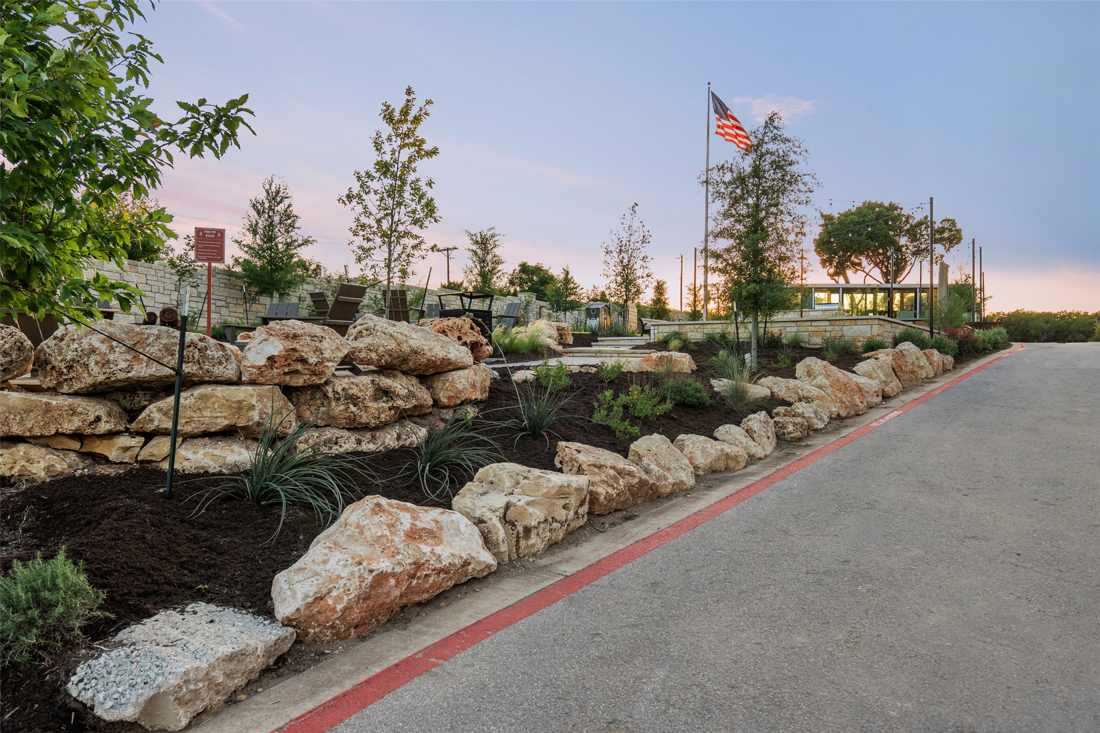 9803 Ribelin Ranch Court, Unit 6 Austin, TX 78750 - Photo 29 of 31 Natural rock formations accent the verdant landscaping along this paved community pathway.