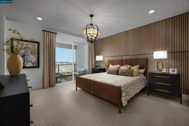 a spacious bedroom with a bed and a walk in closet