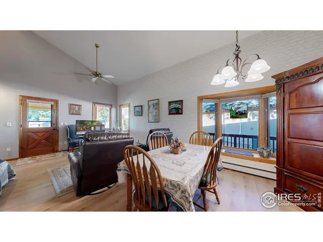 a dining room with furniture and a chandelier
