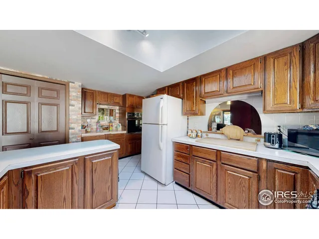 a living room with furniture flat screen tv and fireplace