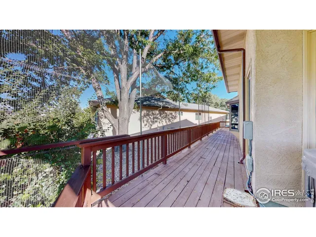 a living room with furniture and a chair