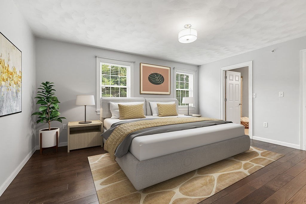 2 Ricciuti Drive, Unit 9 Quincy, MA 02169 - Photo 21 of 40 a spacious bedroom with a bed and window