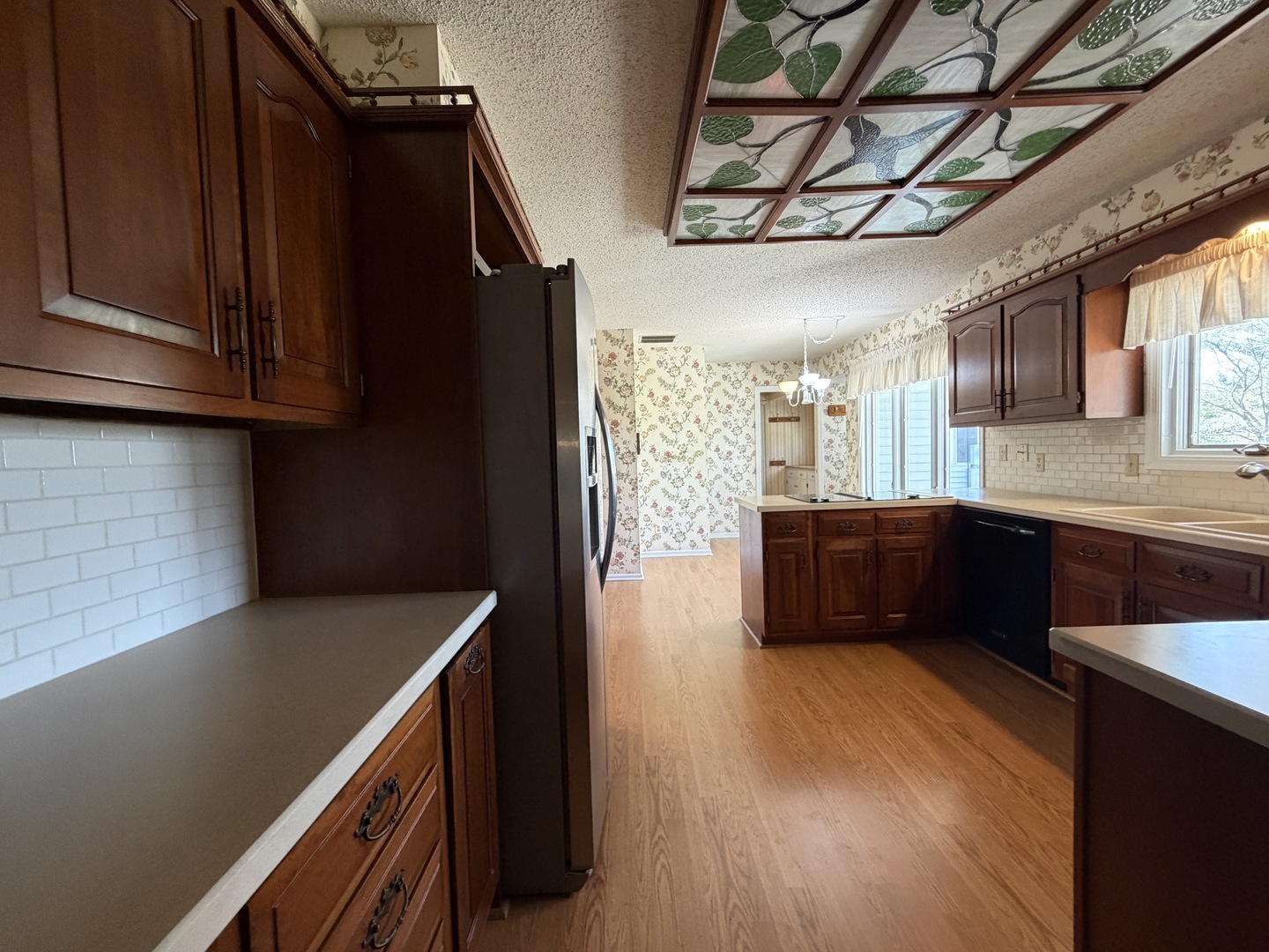 24 South Country Club Road Mattoon, IL 61938 - Photo 14 of 62 a kitchen with stainless steel appliances a sink cabinets and wooden floor
