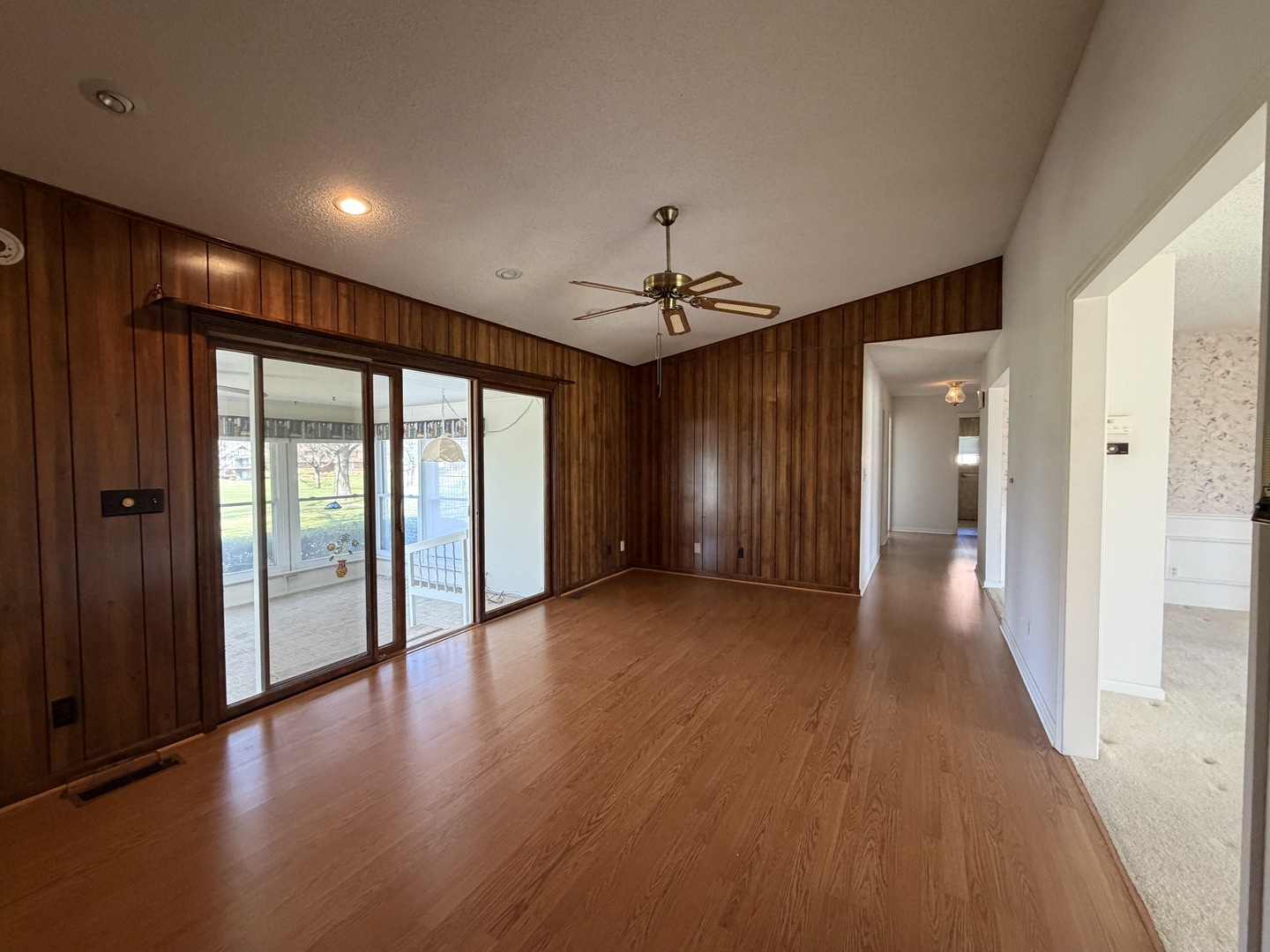 24 South Country Club Road Mattoon, IL 61938 - Photo 22 of 62 a view of a hallway with wooden floor and windows