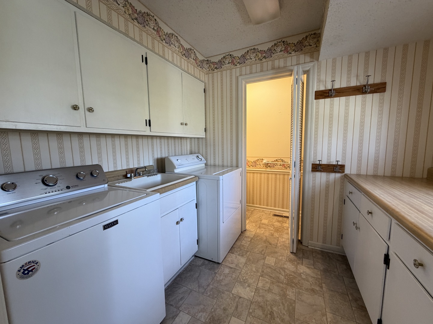 24 South Country Club Road Mattoon, IL 61938 - Photo 29 of 62 a kitchen with cabinets a sink and appliances