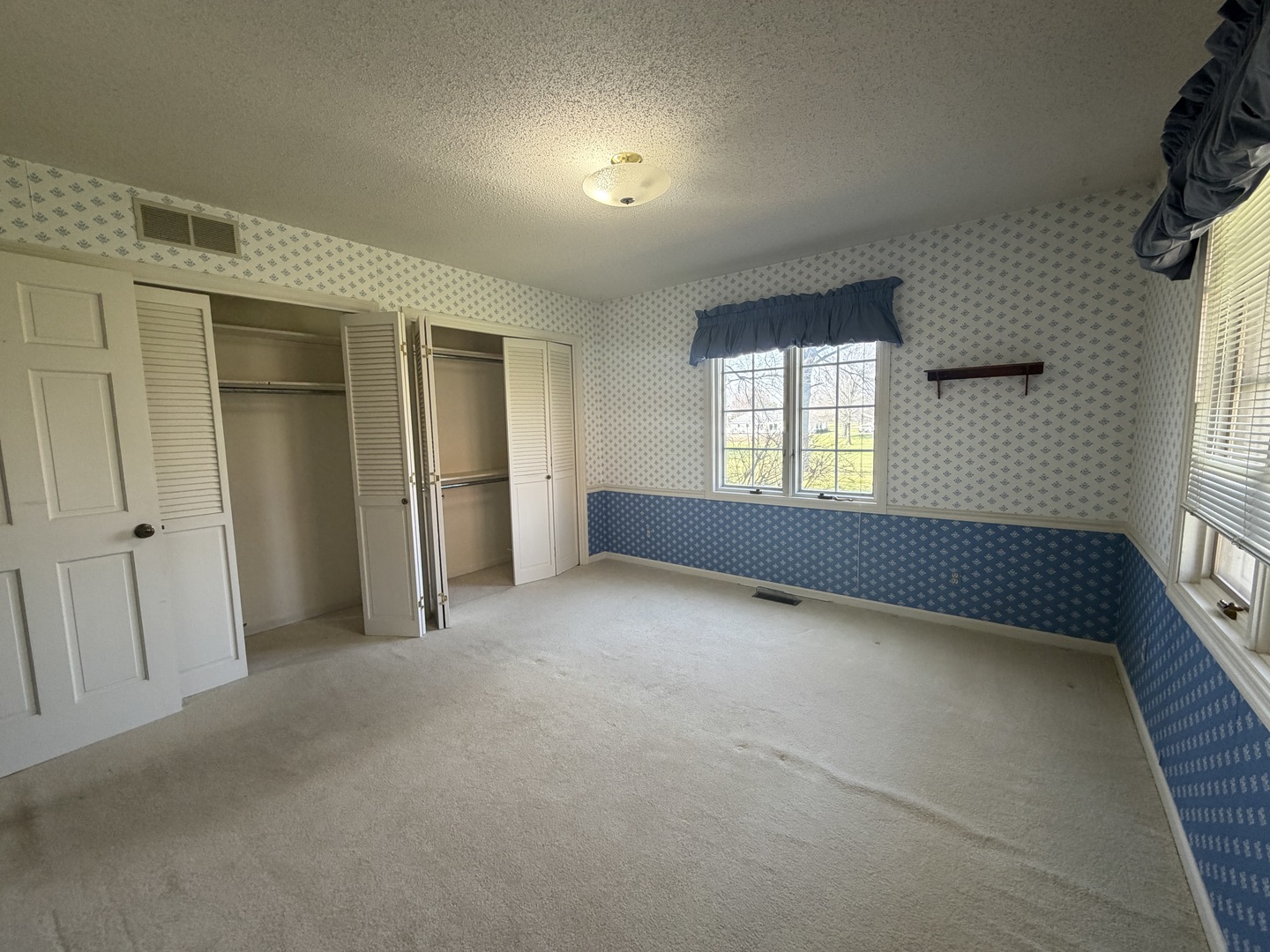 24 South Country Club Road Mattoon, IL 61938 - Photo 41 of 62 a view of an empty room with a window and wooden floor