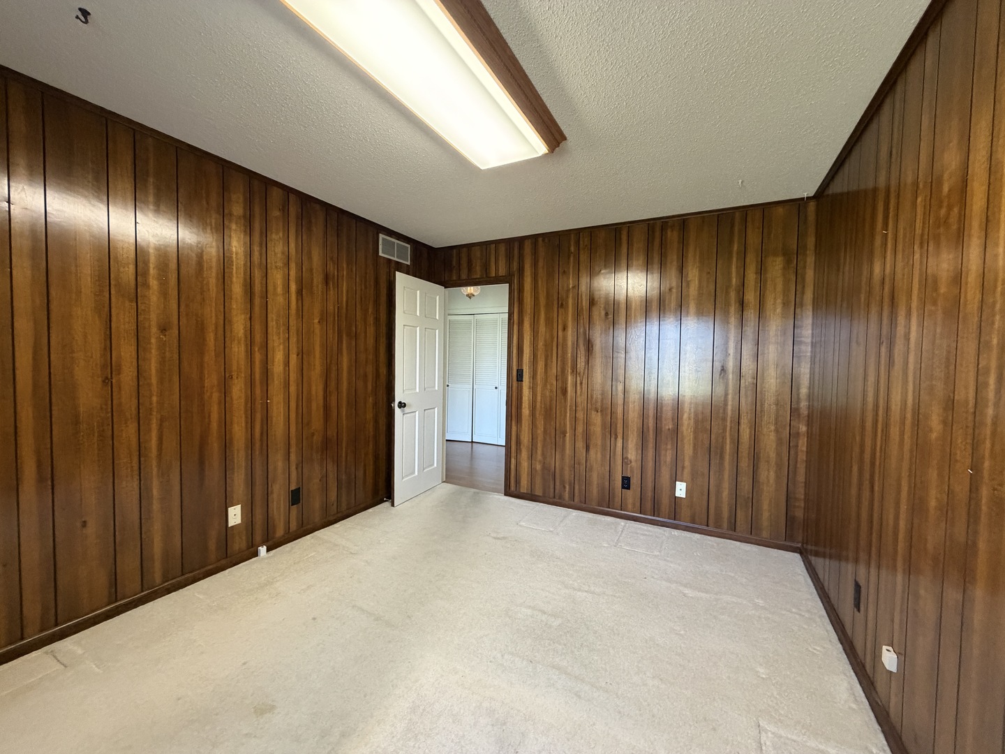 24 South Country Club Road Mattoon, IL 61938 - Photo 47 of 62 a view of an empty room with wooden walls