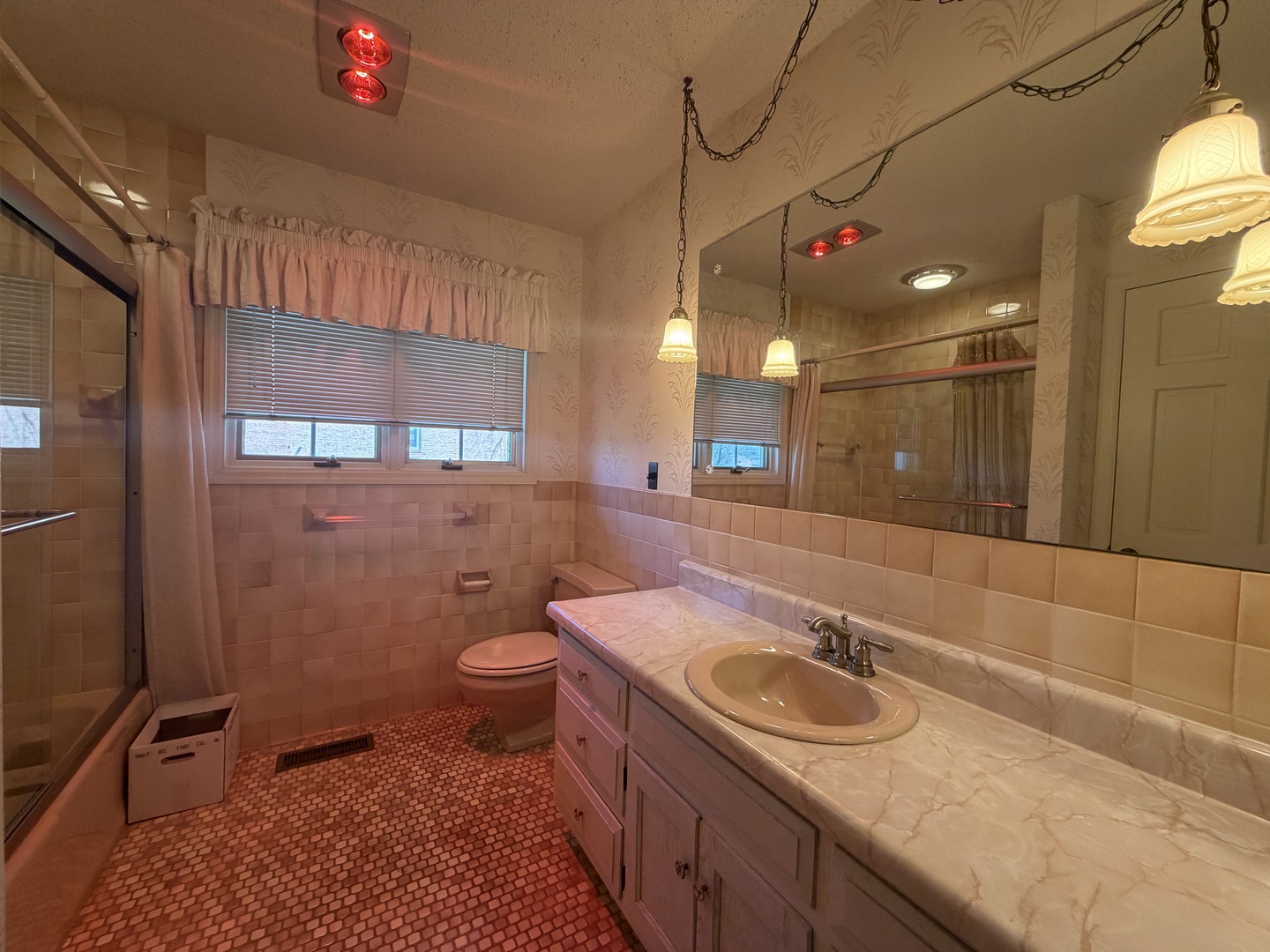 24 South Country Club Road Mattoon, IL 61938 - Photo 49 of 62 a bathroom with a sink a toilet a mirror and shower