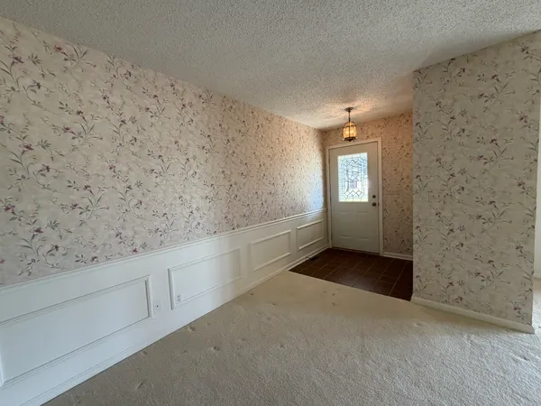 an empty room with windows and view