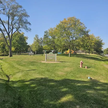 a view of a park with large trees