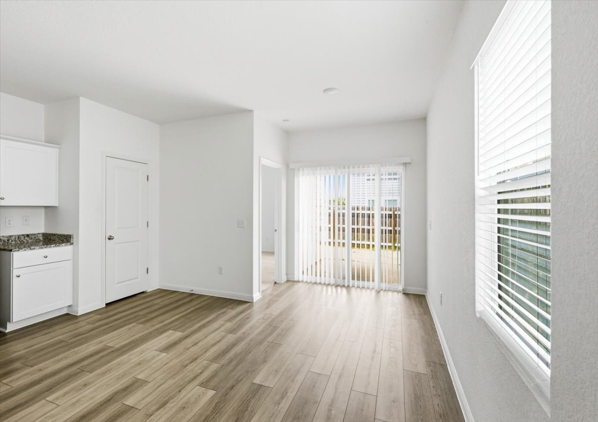 202 Peridot Pass Maxwell, TX 78656 - Photo 11 of 21 Hardwood floors and generous natural light create an inviting atmosphere.