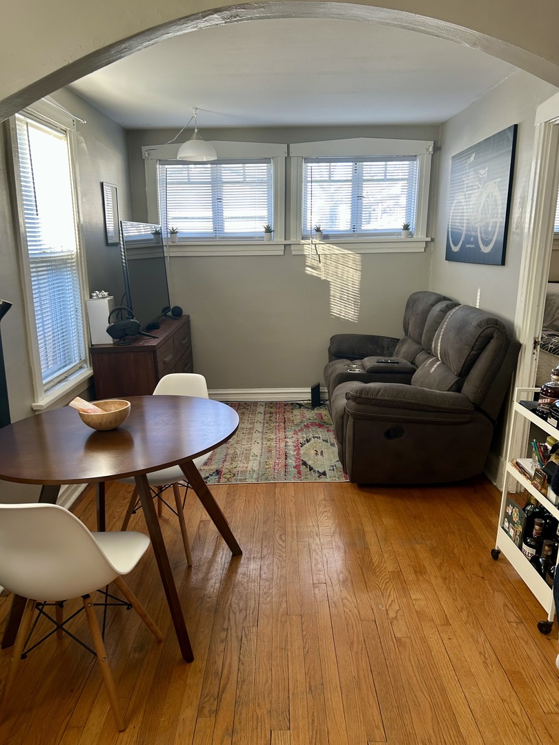 7723 Adams Street Forest Park, IL 60130 - Photo 3 of 7 a living room with furniture and a wooden floor