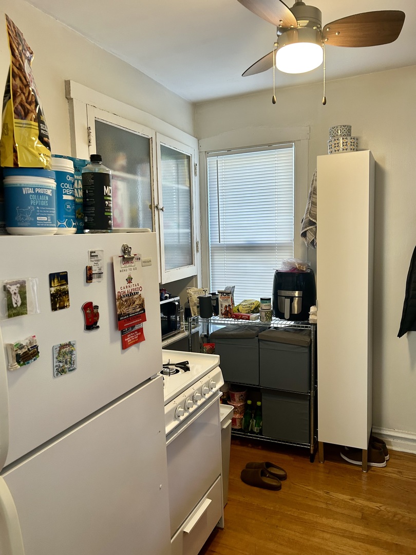 7723 Adams Street Forest Park, IL 60130 - Photo 5 of 7 a room with stainless steel appliances a stove a refrigerator and a refrigerator