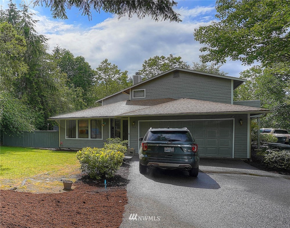 726 Roe Street Steilacoom, WA 98388 - Photo 1 of 29 a car parked in front of a house