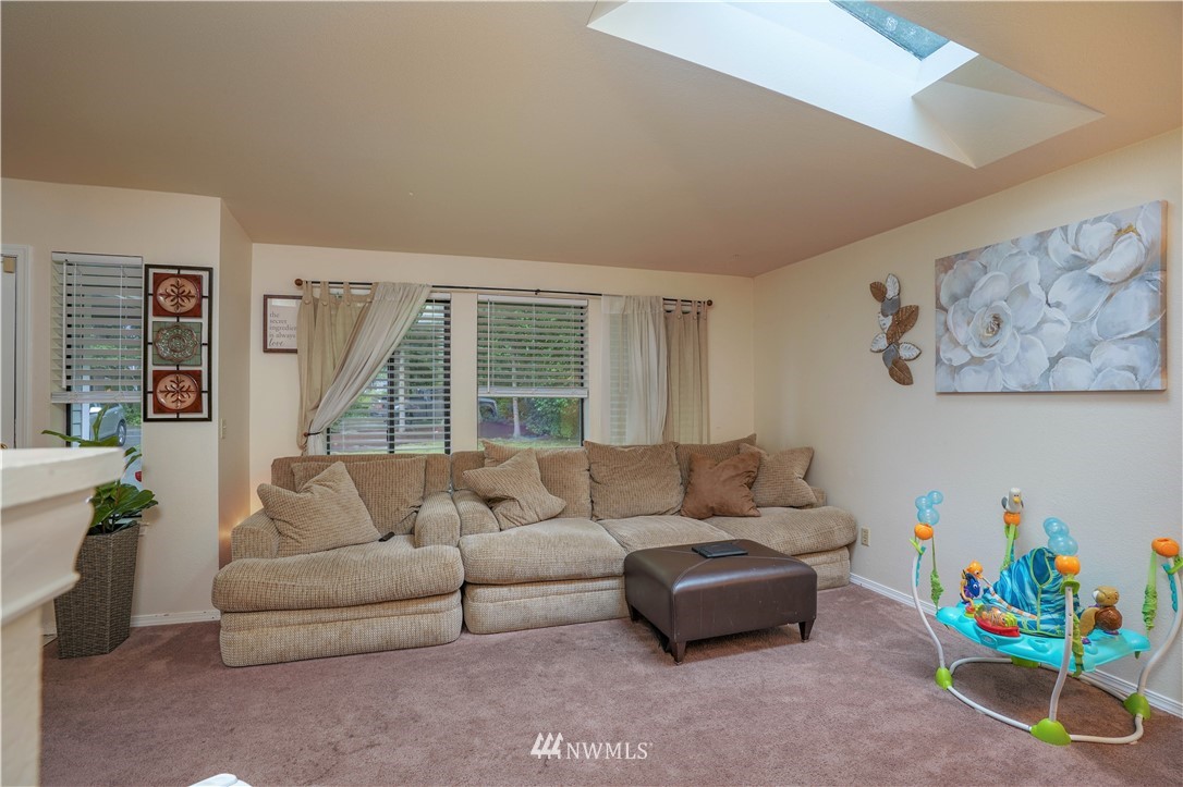 726 Roe Street Steilacoom, WA 98388 - Photo 12 of 29 a living room with furniture and a large window