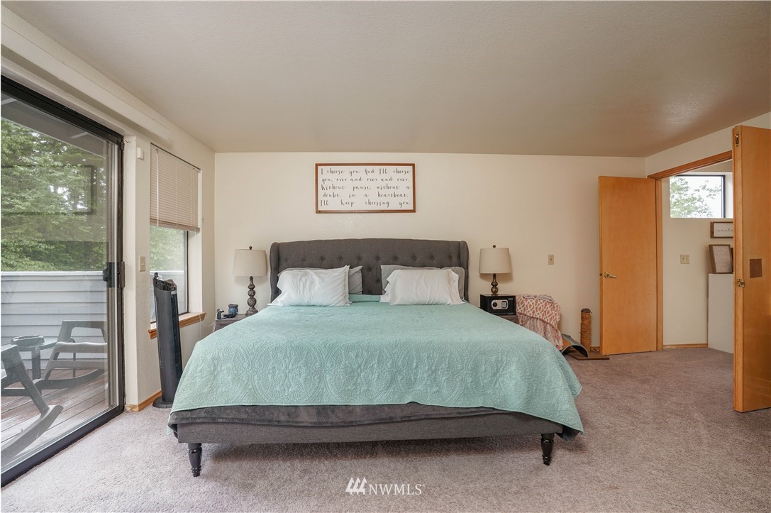 726 Roe Street Steilacoom, WA 98388 - Photo 26 of 29 a bedroom with a bed and a night stand