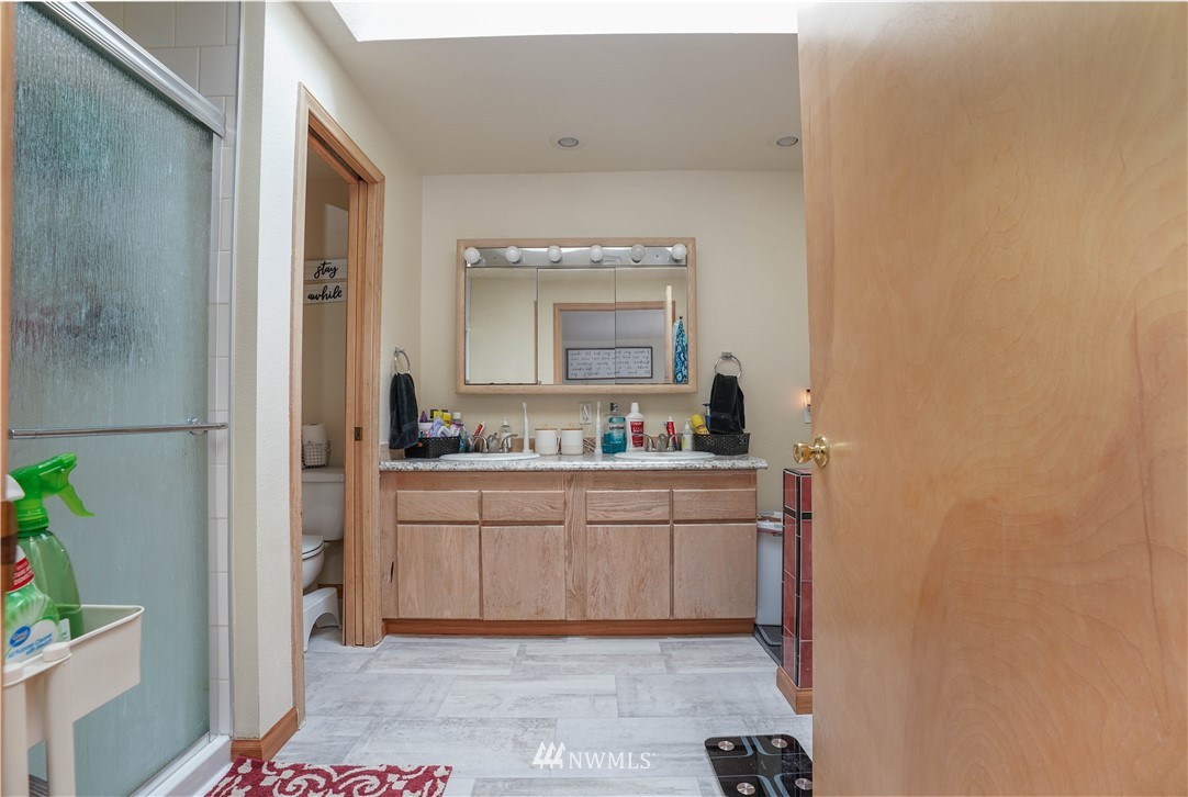 726 Roe Street Steilacoom, WA 98388 - Photo 27 of 29 a bathroom with a sink and a mirror