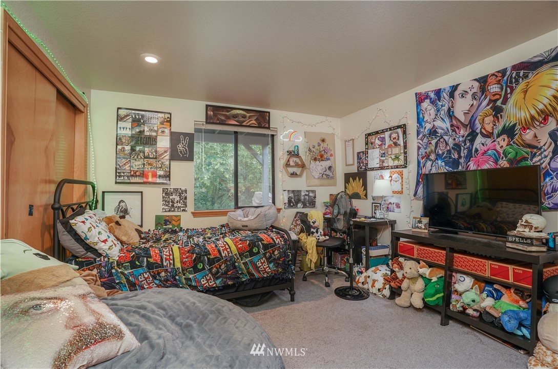 726 Roe Street Steilacoom, WA 98388 - Photo 29 of 29 a bedroom with furniture and a flat screen tv