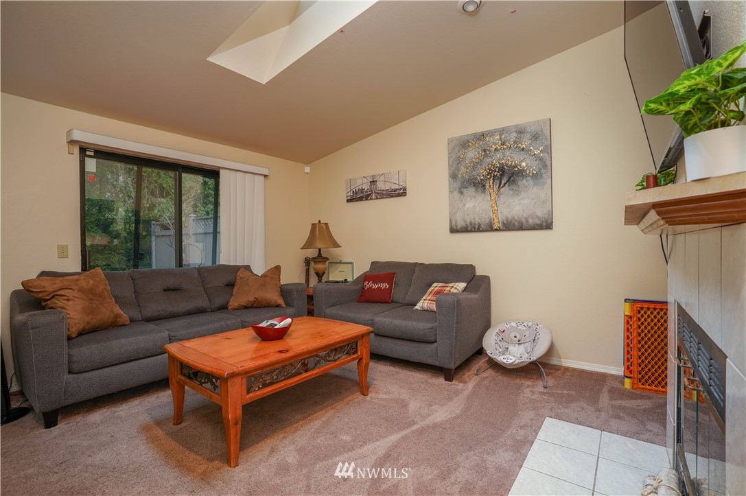 726 Roe Street Steilacoom, WA 98388 - Photo 9 of 29 a living room with furniture and a potted plant