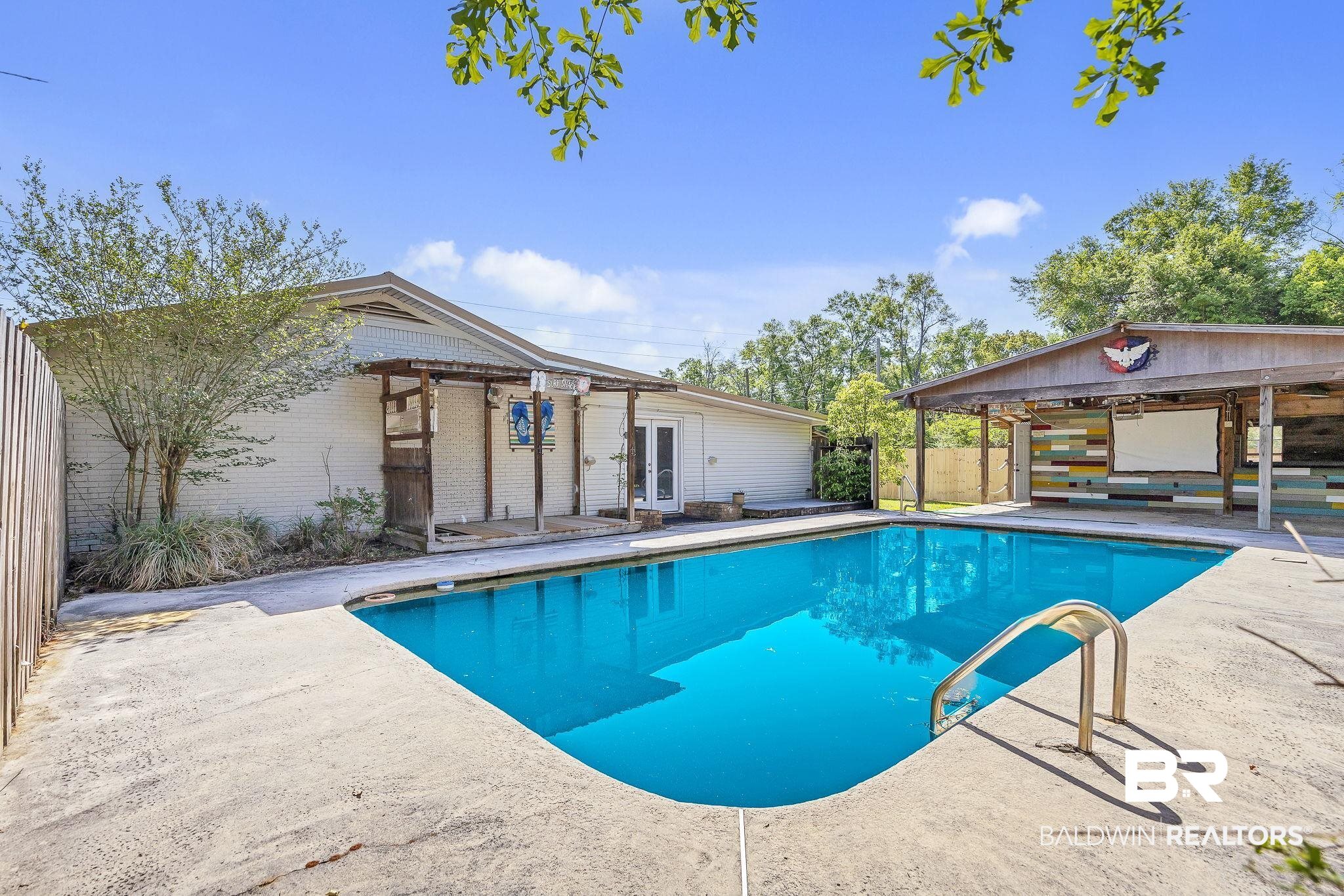 11964 Stroh Road Daphne, AL 36527 - Photo 57 of 58 Pool with a patio, french doors, and fence private yard