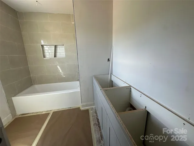 a bathroom with a bathtub and a sink