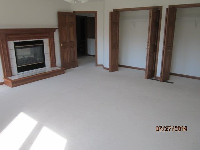 11545 Prestwick Road Belvidere, IL 61008 - Photo 12 of 14 a view of an empty room and fire place