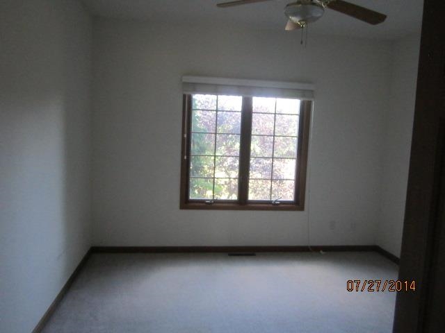 11545 Prestwick Road Belvidere, IL 61008 - Photo 8 of 14 an empty room with a window