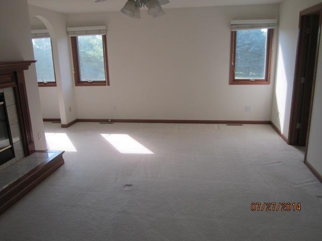 11545 Prestwick Road Belvidere, IL 61008 - Photo 10 of 14 an empty room with windows