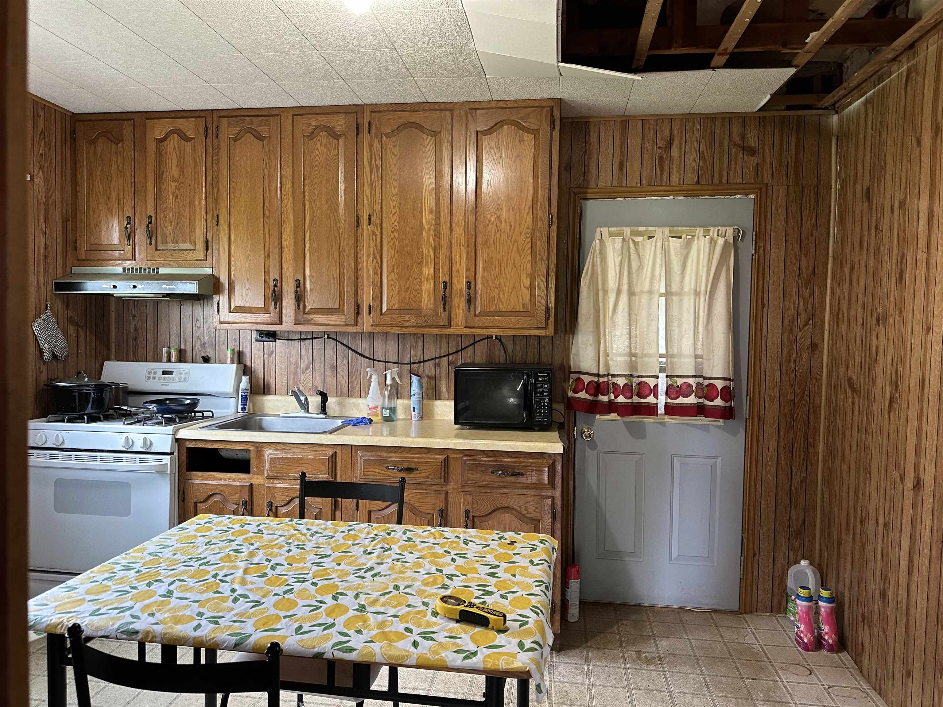 206 Viaduct Road Savanna, IL 61074 - Photo 2 of 14 a bed sitting in a kitchen next to a window