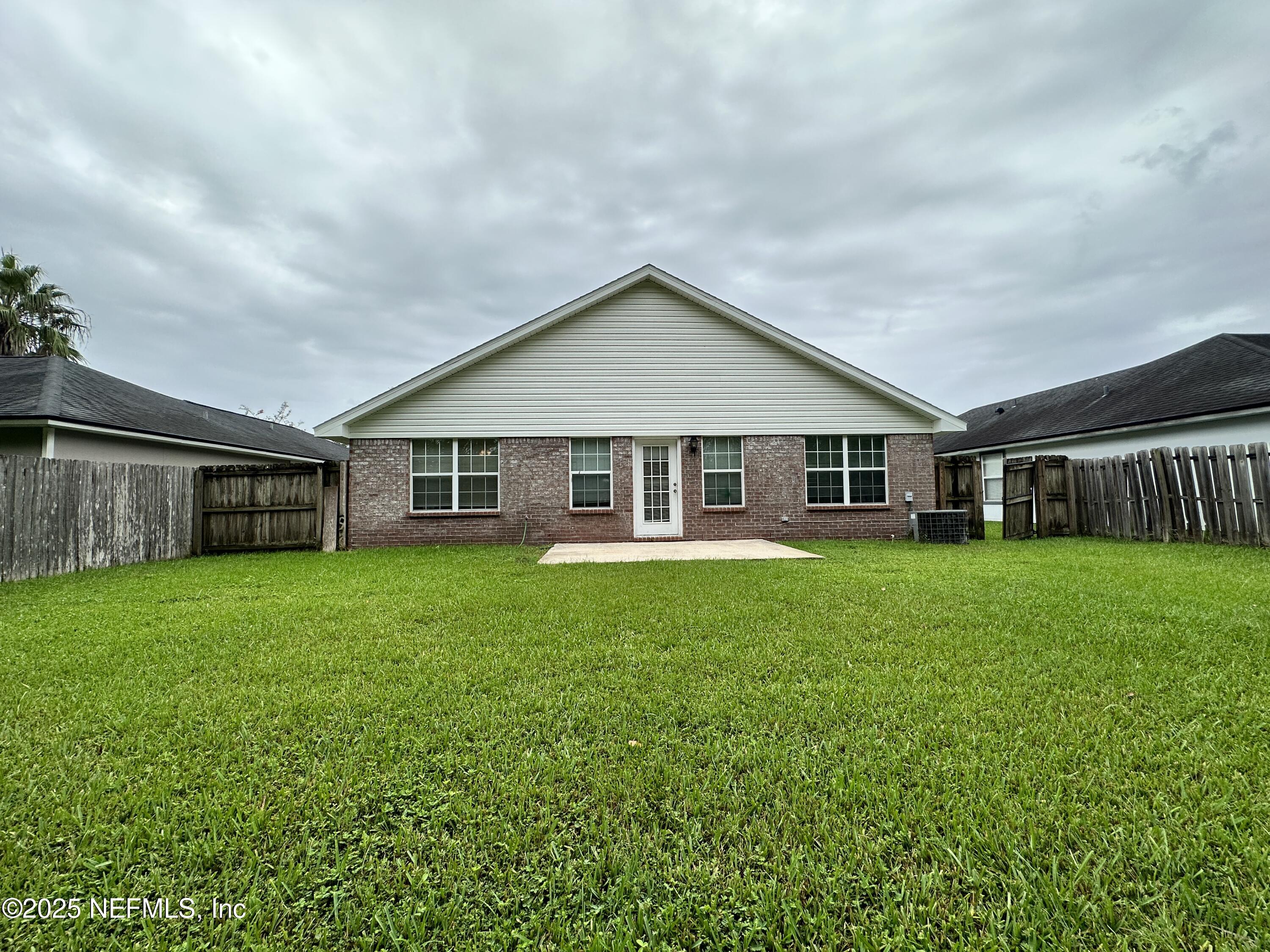 2478 Aloha Lane Middleburg, FL 32068 - Photo 13 of 16 a view of a house with backyard and garden