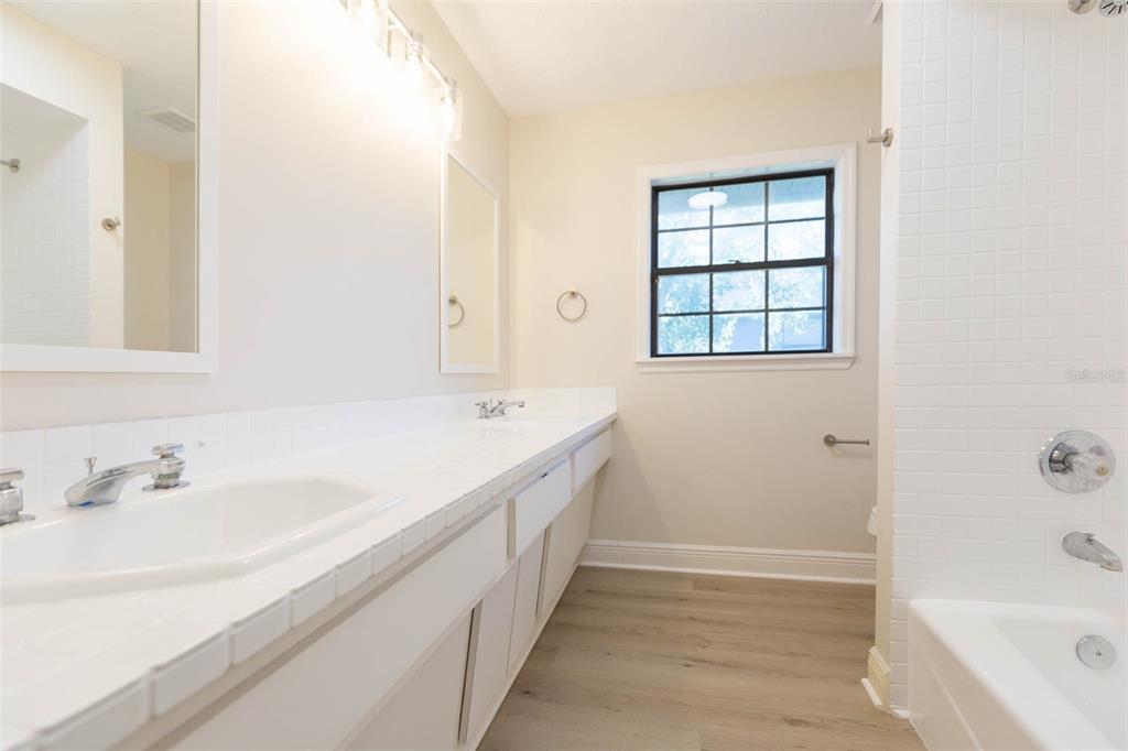 937 Bunker View Drive Apollo Beach, FL 33572 - Photo 35 of 73 a bathroom with a tub sink and mirror