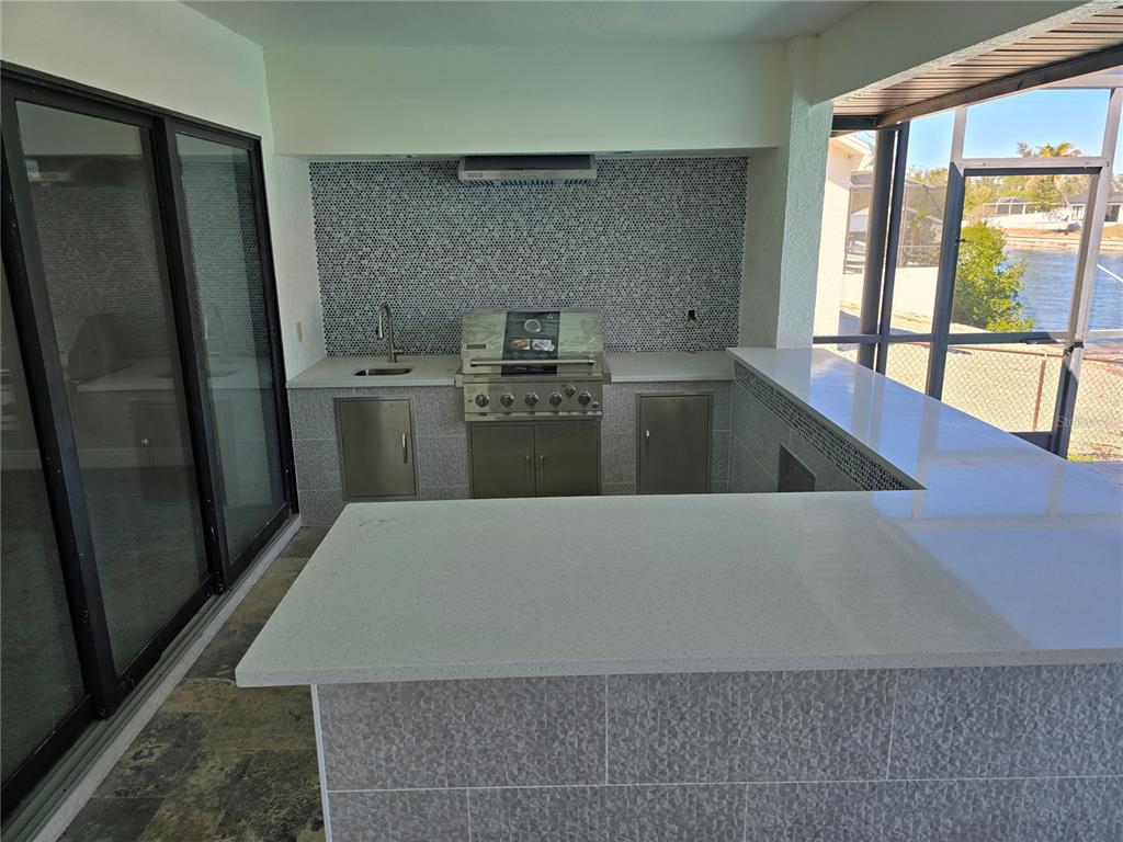 937 Bunker View Drive Apollo Beach, FL 33572 - Photo 46 of 73 a kitchen with a refrigerator and a sink